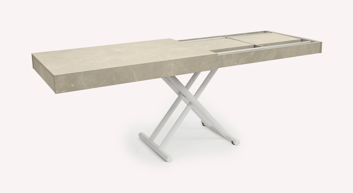 Table extensible Boston avec plateau en marbre beige et pieds croisés blancs, vue en packshot