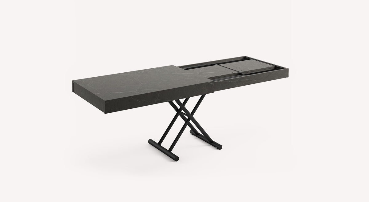 Table extensible Boston avec plateau gris foncé et pieds croisés noirs, partiellement déployée
