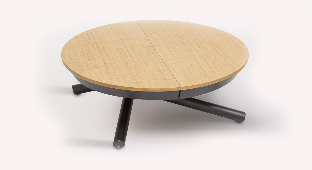 Table basse ronde relevable Helios en bois clair avec pieds noirs