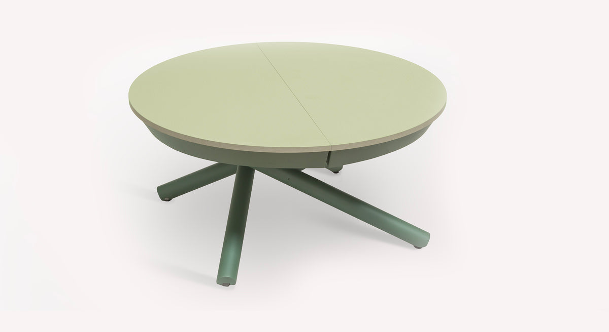 Table extensible ronde Helios en vert clair avec pieds croisés, vue en packshot