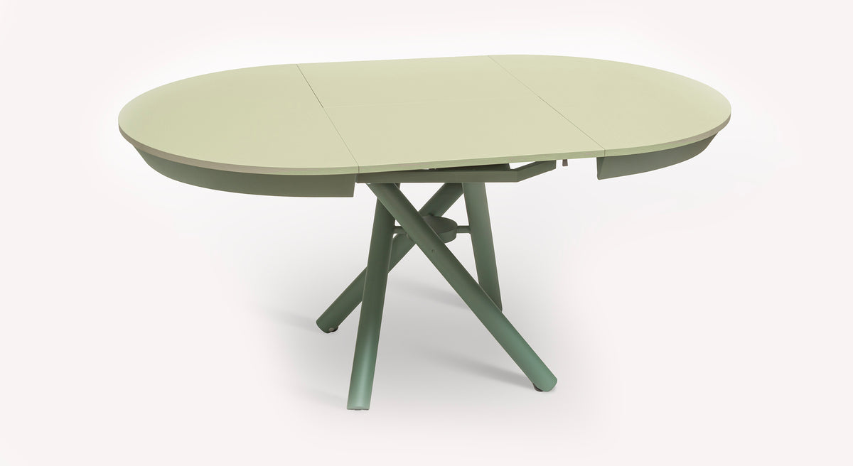 Table ovale extensible Helios M27 en vert clair, avec pieds croisés, ouverte