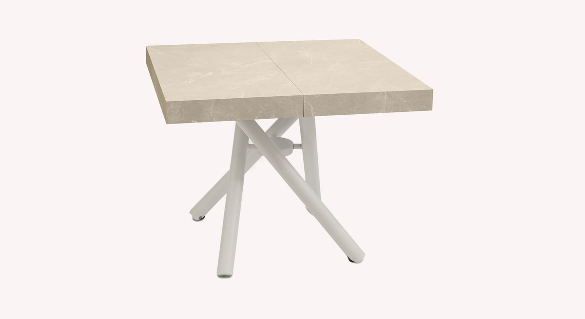 Table extensible Levante avec plateau en marbre beige et pieds croisés blancs