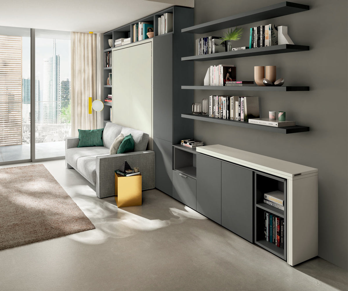 Salon moderne avec canapé gris et rangement mural intégré, présenté dans une ambiance lumineuse mettant en valeur le modèle GIRO +50 coloris & matériaux.