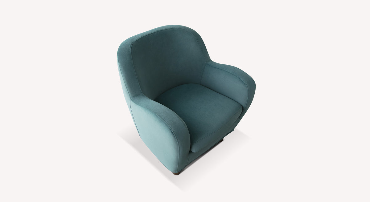 Fauteuil Bowa en velours vert mat, design élégant avec accoudoirs arrondis, vu de trois quarts sur fond blanc