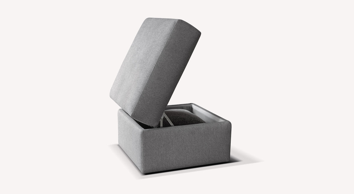 Pouf Coffre DIENNA Gemma Silver en tissu gris argenté avec rangement intérieur, design moderne et fonctionnel idéal pour compléter un canapé convertible ou un salon.