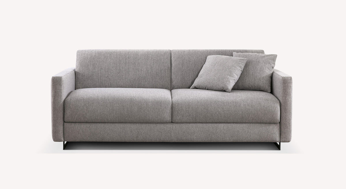 Lot canapé et pouf JUSTIN en tissu gris clair avec design moderne et épuré, idéal pour un salon contemporain alliant confort et fonctionnalité.