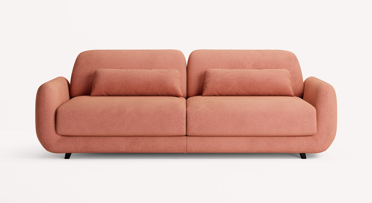 Canapé convertible MOON Moby Corail en tissu corail avec design arrondi, idéal pour un couchage quotidien offrant confort et style moderne.