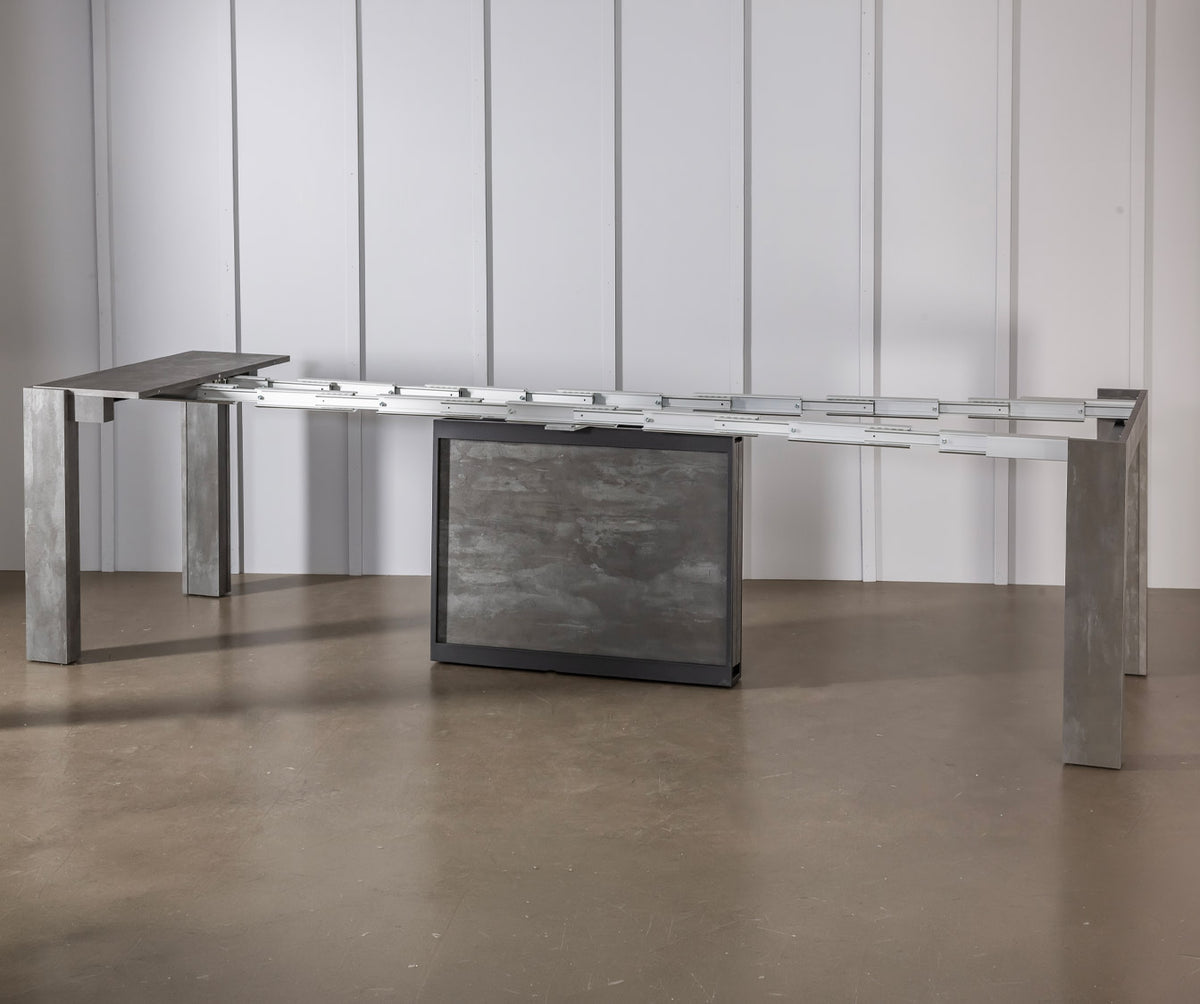 Table extensible moderne en COMPACT Mélaminé Pietra avec finition pierre grise, idéale pour optimiser l'espace tout en apportant une touche élégante et contemporaine.