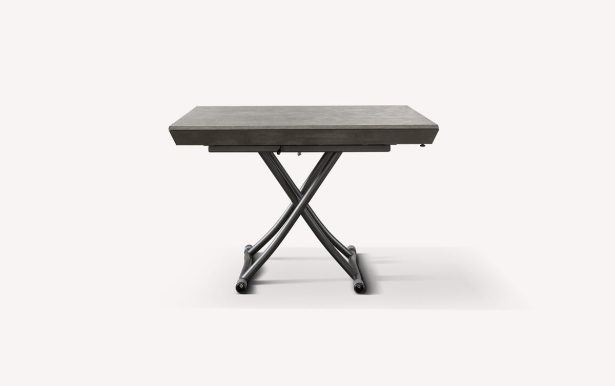 Table extensible grise fermée avec pieds croisés en métal, modèle Piu Piu