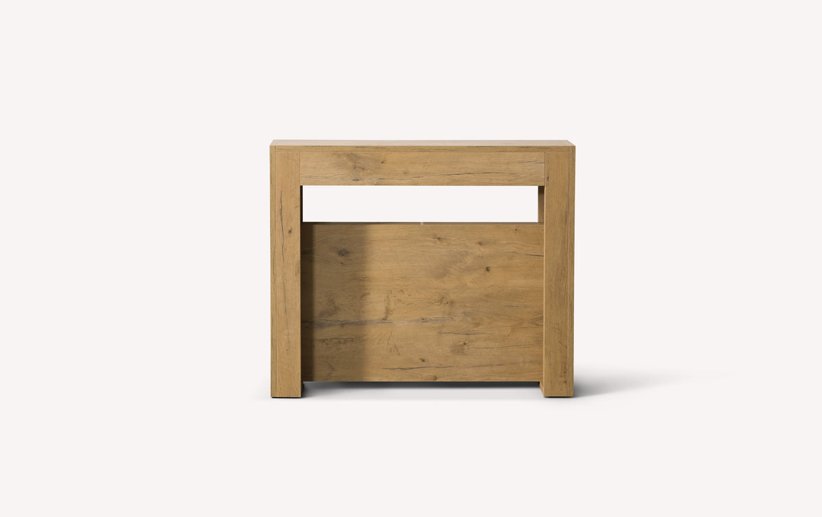 Lot canapé STELLA et table SLIMMY montrant une table extensible en bois clair au design moderne et épuré, idéale pour accompagner un canapé convertible.