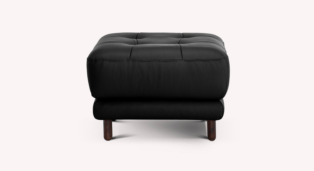 Pouf noir Clark Sydney avec pieds en bois, design moderne et capitonnage élégant