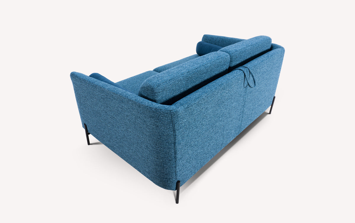 Canapé convertible en tissu denim bleu, vue arrière, avec pieds noirs fins