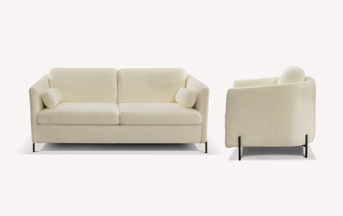 Lot canapé et fauteuil LAPP en tissu bouclette ivoire, design moderne avec accoudoirs arrondis et coussins cylindriques, parfait pour un salon élégant et confortable.
