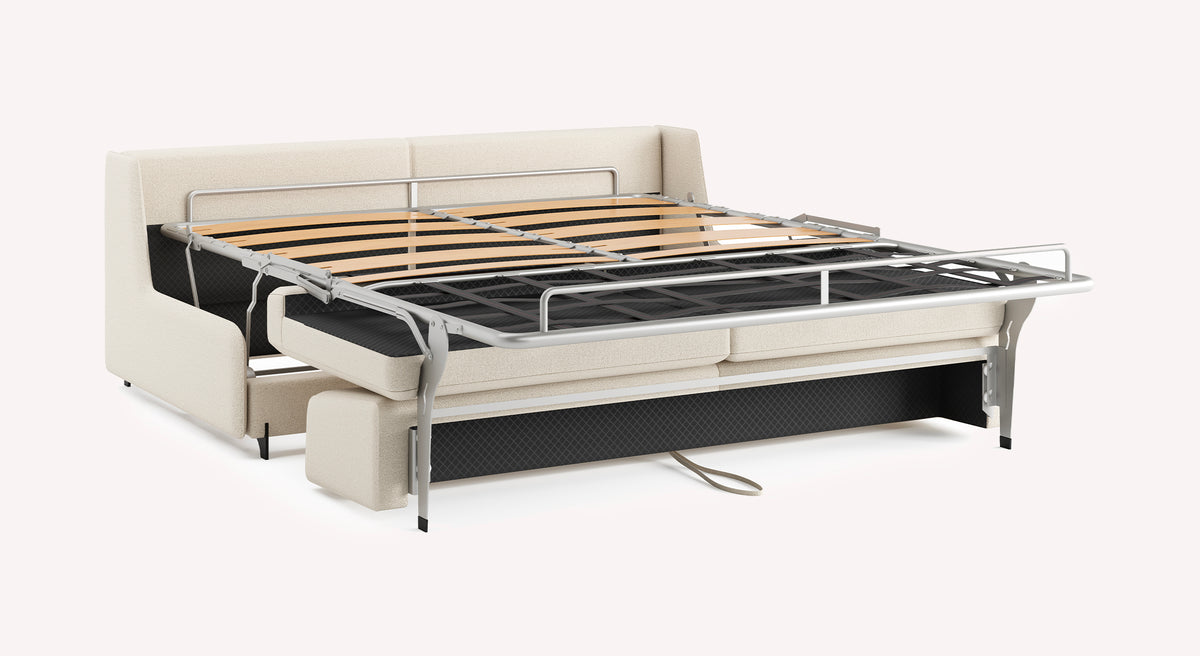 Canapé convertible NELLY Compact Innuendo Ivoire déployé en couchage avec structure métallique et lattes en bois, offrant une solution pratique et élégante pour couchage quotidien.