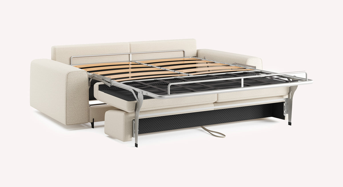 Canapé convertible NELLY Large Innuendo Ivoire en tissu ivoire avec structure métallique déployée, idéal pour couchage quotidien.