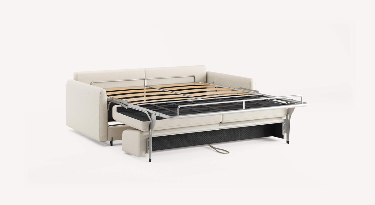 Canapé convertible NELLY Innuendo Ivoire avec structure métallique dépliée et tissu ivoire, conçu pour un couchage quotidien confortable.