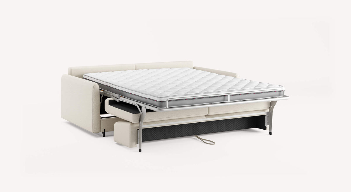 Canapé convertible NELLY Innuendo Ivoire ouvert en lit avec matelas confortable, idéal pour couchage quotidien, design élégant et fonctionnel de La Maison Convertible.