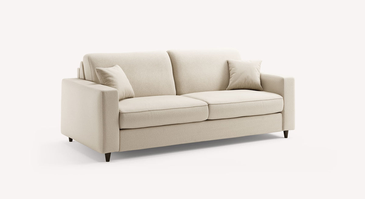 Canapé convertible Alba en tissu ivoire, design moderne avec accoudoirs carrés et deux coussins assortis