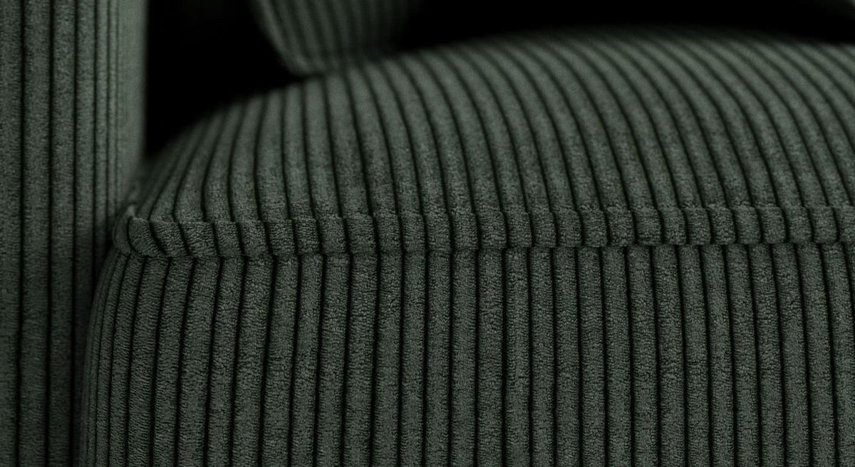 Gros plan sur le tissu côtelé vert sapin d'un canapé convertible Cocoon Lincoln