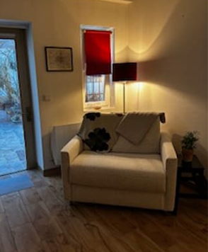 Fauteuil convertible Jimmy dans un salon