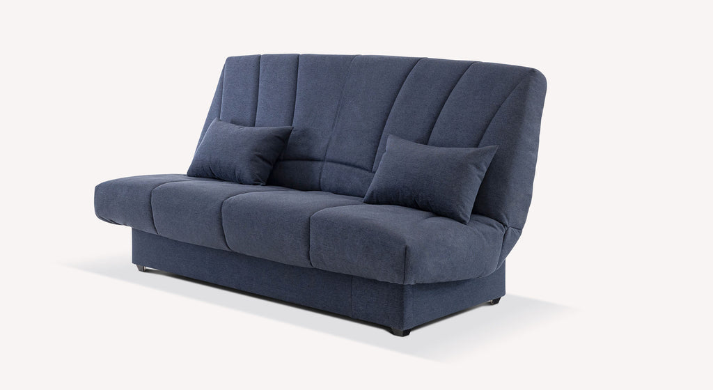 Canapé convertible clic-clac en tissu bleu foncé, modèle MONTRÉAL Austin Deep blue, avec coussins assortis pour un confort optimal.