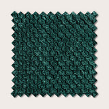 Échantillon de tissu vert sapin avec revêtement en relief, bord dentelé