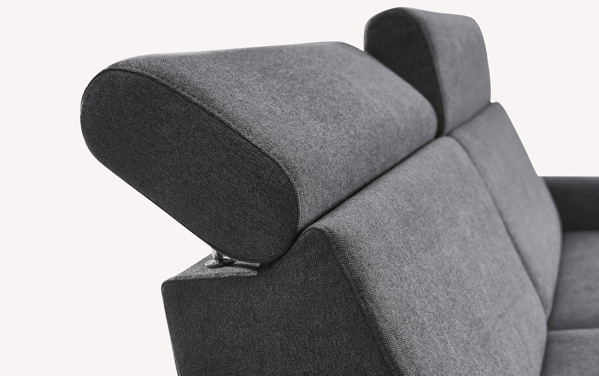 Détail de l’appui-tête du canapé convertible AMY Austin Anthracite en tissu gris anthracite, offrant un confort modulable pour un couchage quotidien.