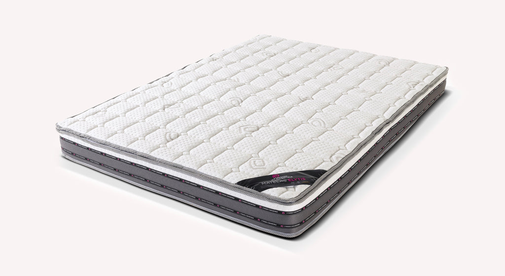 Matelas ELYTIS de couleur claire avec coutures précises, conçu pour offrir un confort optimal et un soutien adapté, idéal pour un couchage quotidien de qualité.