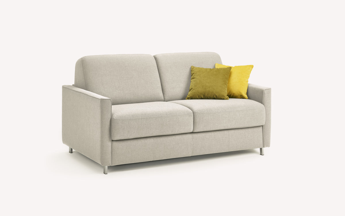 Canapé convertible JIMMY Foster Ivoire en tissu clair avec deux coussins décoratifs, design moderne et compact idéal pour un couchage quotidien confortable.