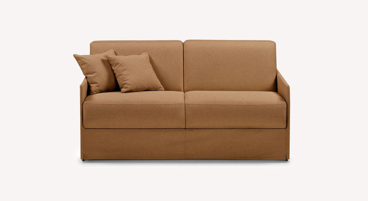 Canapé convertible en tissu couleur cuivre avec deux coussins assortis, modèle Lia