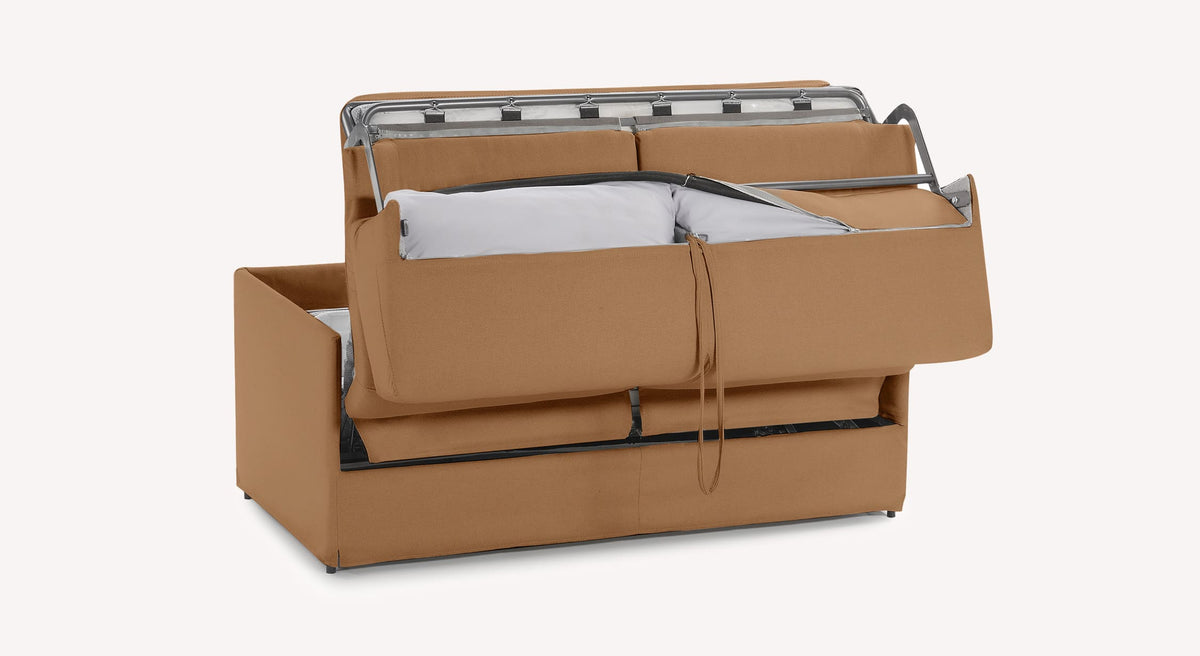 Canapé convertible en tissu couleur cuivre, modèle Lia, avec mécanisme de dépliage visible