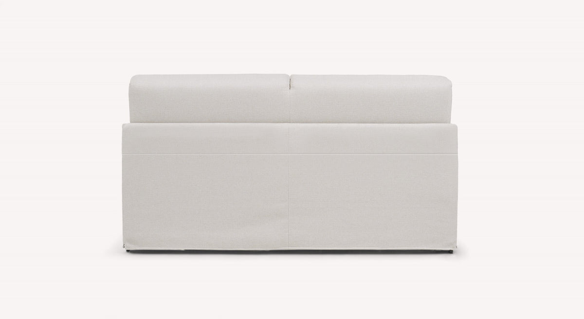 Canapé convertible en tissu ivoire vu de dos, modèle Lia Barrel, design épuré et moderne