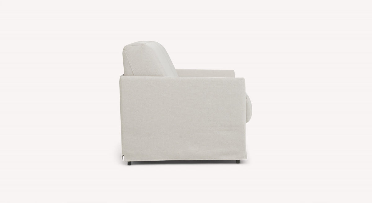 Canapé convertible en tissu ivoire vu de côté, modèle Lia Barrel