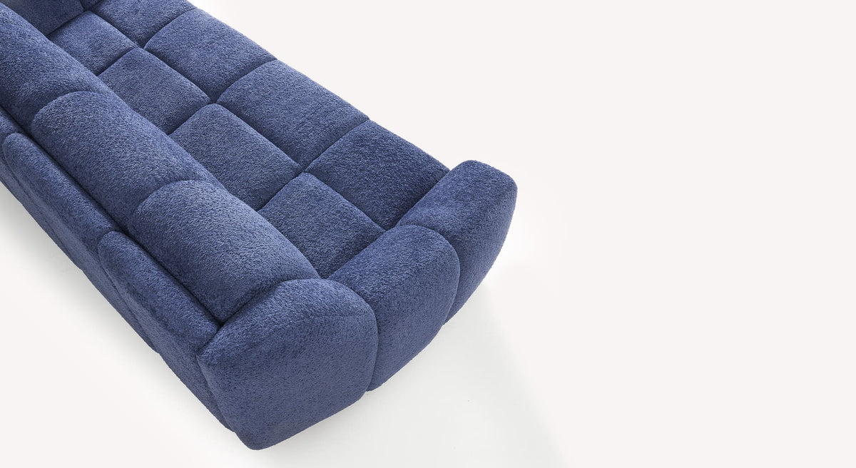 Canapé convertible MAMA Sogno Ocean en tissu bleu océan, design contemporain avec matelassage capitonné pour un confort optimal et un couchage quotidien pratique.