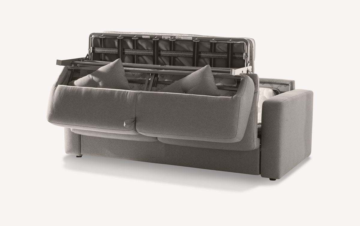 Canapé convertible en tissu gris, modèle Will Luna Brume, avec mécanisme de dépliage visible et coussins intégrés