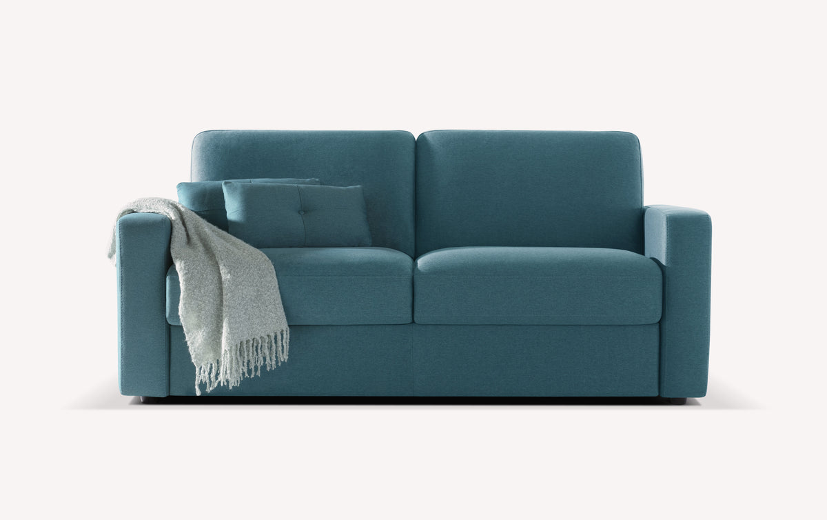 Canapé convertible en tissu bleu lagon avec coussin et plaid gris. Modèle Will, design moderne et épuré
