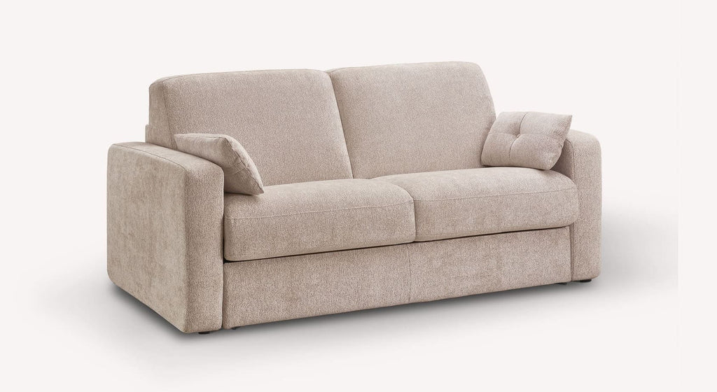 Canapé convertible WILL Misterio Brume en tissu beige clair avec coussins assortis, design moderne et confortable adapté pour un couchage quotidien.