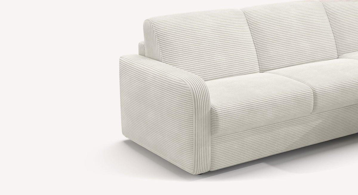 Canapé convertible CLINT Angle Lincoln Neige en tissu blanc cassé avec accoudoir arrondi et assise confortable adapté pour un couchage quotidien.
